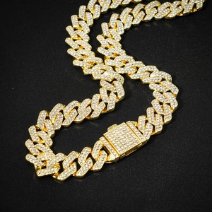 Iced out 14mm gold-plated rhombic Cuban link necklace with sparkling crystals on black background