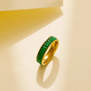 Eternity band ring in gold stainless steel with emerald green square-cut cubic zirconia