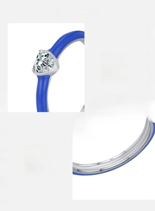 Close-up of S925 sterling silver stamp and blue enamel heart with cubic zirconia