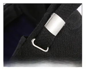 Detail of adjustable metal buckle on black winter baseball cap with textured fabric