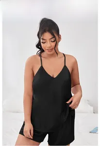 Detail of black satin two-piece sleepwear set with V-neck camisole and shorts
