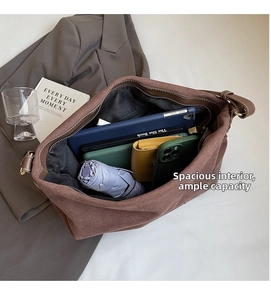 Top view of spacious interior in brown faux suede tote bag showing large storage capacity