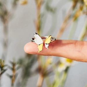 Macro shot of s925 silver butterfly ring featuring dual-tone gold and silver plating