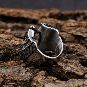 Vintage stainless steel wing ring with detailed feather texture in retro silver finish