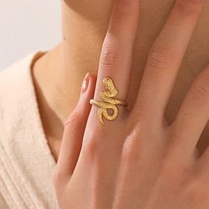18K gold plated stainless steel snake ring with textured scale detail on model hand