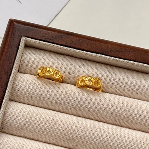 Gold plated ancient coin round hoop earrings displayed in a luxury wooden jewelry box