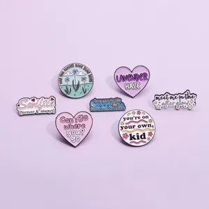 Pastel enamel pins set with Taylor Swift inspired lyrics and Lavender Haze heart designs