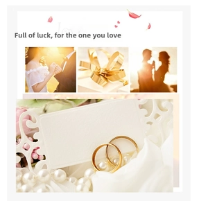 Detail view of 18K gold plated C-shaped earrings with pearls on a decorative white gift card