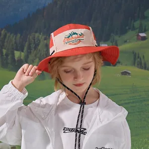 Kids orange outdoor sun hat with wide brim, waterproof fabric and adjustable wind cord