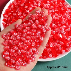 Miniature red resin Christmas charms featuring heart and snowflake glove designs for DIY