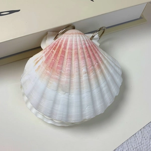 Artistic shell-shaped loose-leaf notebook with pink gradient and natural shell texture