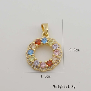 Macro detail of 2.2cm round pendant with multi-color zircon stones in 18K gold plating