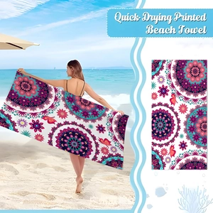 Quick-drying microfiber beach towel featuring vibrant red and teal mandala printed patterns