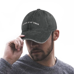 Side view of dark grey washed cotton baseball cap with My Dog Is My Shrink embroidery