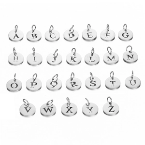 Macro view of 26 round silver stainless steel hollow alphabet letter pendants for jewelry DIY