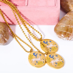 Detail of 18K gold plated necklaces featuring hand-painted rabbit tarot oval pendants