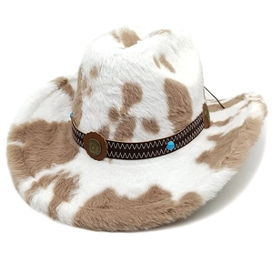 Close-up of cow print cowboy hat with brown leather band and turquoise stone details
