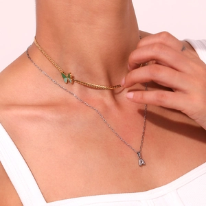Layered gold Cuban chain with green butterfly and silver letter A pendant necklace