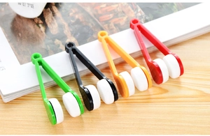 Macro view of portable microfiber eyeglass cleaning clips in four vibrant colors