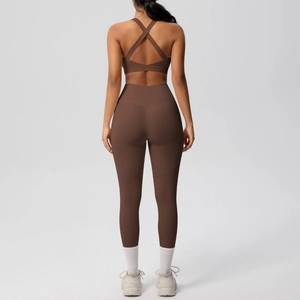 Women's 2-piece yoga set with brown sports bra and high-waisted leggings in matte fabric