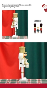 Detail of 26cm white and gold wooden nutcracker soldier with drum and glitter finish