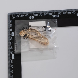 Golden metal hair claw clip size measurement with ruler in quality inspection view