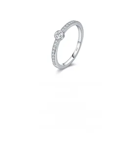 Detailed view of S925 sterling silver band with circular moissanite in bezel setting