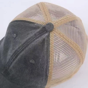 Close-up of a two-tone mesh trucker hat with breathable khaki back and grey canvas brim
