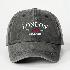 Detailed close-up of the vintage washed cotton texture and London print on this charcoal cap