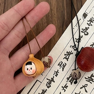 Handmade ethnic wood pendant necklace with garlic and tomato charms on wax rope