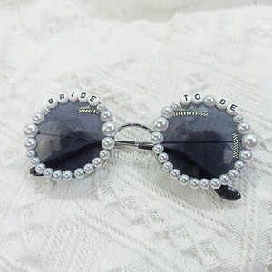 Bride to Be sunglasses with pearls and rhinestones on white lace background