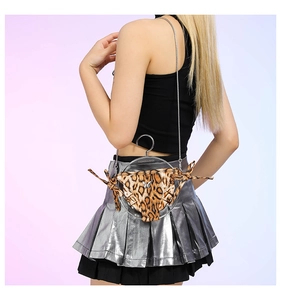 Detail of leopard print bikini shaped crossbody bag with metallic ring and chain strap