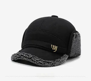 Detail of winter wool baseball cap with grey faux fur lining and ear protection flap