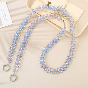 Close-up of iridescent acrylic flat beads on a crossbody phone chain with silver clasps