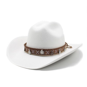 Macro detail of white wool western cowboy hat featuring ethnic braided band and silver charms