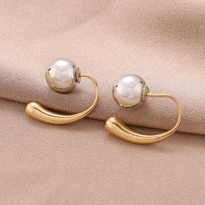 Elegant gold and silver teardrop earrings with a modern minimalist ball design