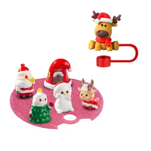 Detailed set of Christmas resin figurines including Santa and reindeer on glitter base