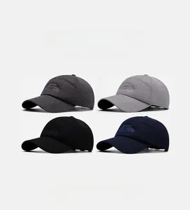 Collage of soft baseball caps with embroidery in grey, black, and navy blue