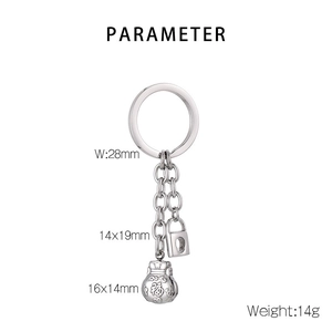 Macro shot of silver stainless steel fortune bag and lock charms on keychain