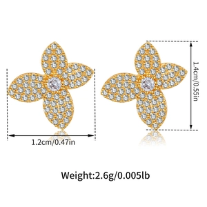 Detail showing dimensions of 18K gold leaf stud earrings with white zircon stones