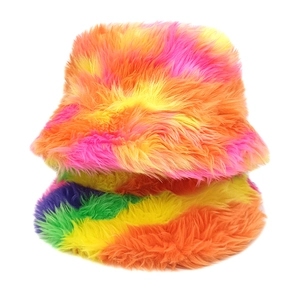 Detailed macro view of rainbow tie-dye faux fur texture on plush bucket hat and scarf set