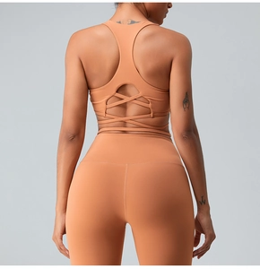 Detailed back view of terracotta racerback sports bra with cross-strap hollow design