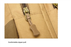 Close-up of khaki tactical chest bag with high-density nylon fabric and green zipper detail