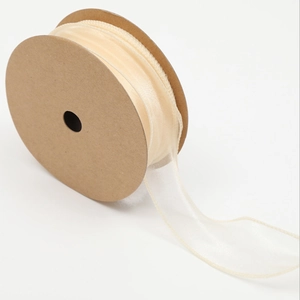 Elegant cream translucent organza ribbon roll with wavy edges for floral gift wrapping