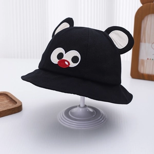 Detail of baby sun hat featuring 3D ears and cute cartoon embroidery on black cotton
