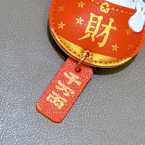 Red leather fortune cat keychain with gold Lucky and Peace characters for bags
