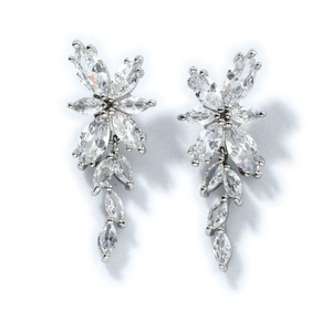 Elegant silver tassel earrings with marquise-cut peridot and zircon floral design