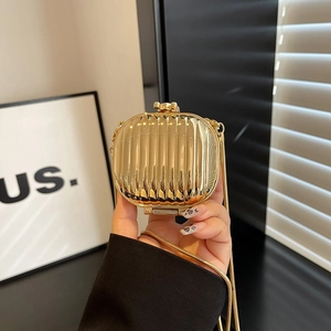 Golden acrylic mini lipstick evening bag with vertical stripes and metal chain strap