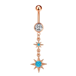 Detail of rose gold belly ring with sparkling star pendants and blue zircon stones