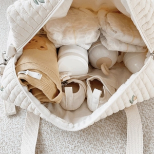 Quilted mummy bag with bear embroidery featuring a large capacity for baby essentials